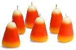 Floating small candy corn candles