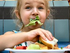 Girl With Lettuce In Mouth