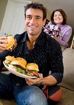 Guy with Plate of Sandwiches