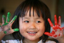 Little Girl With Paint On Hands